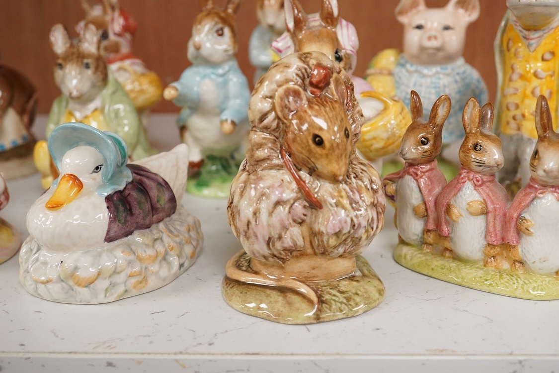 Twenty Beatrix Potter figures, mostly later production figures, largest 11cm high